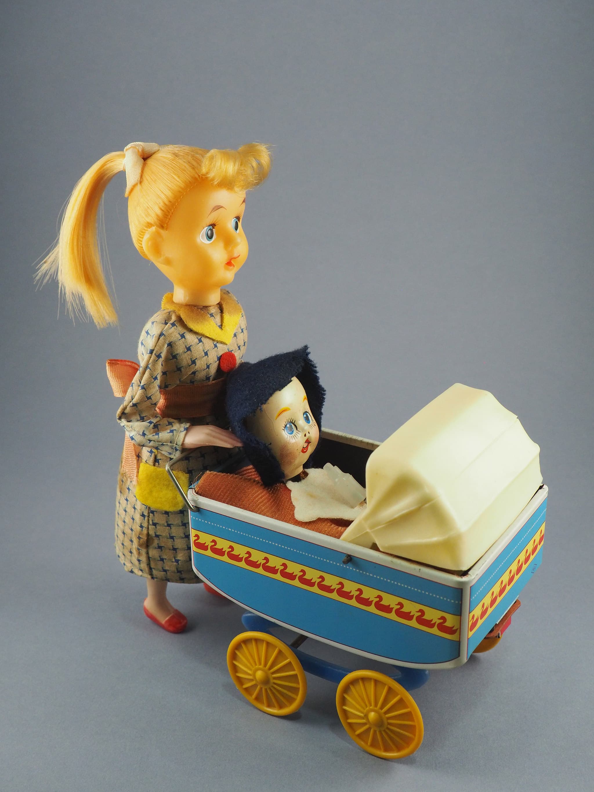 Baby and Carriage with Pony Tail Girl