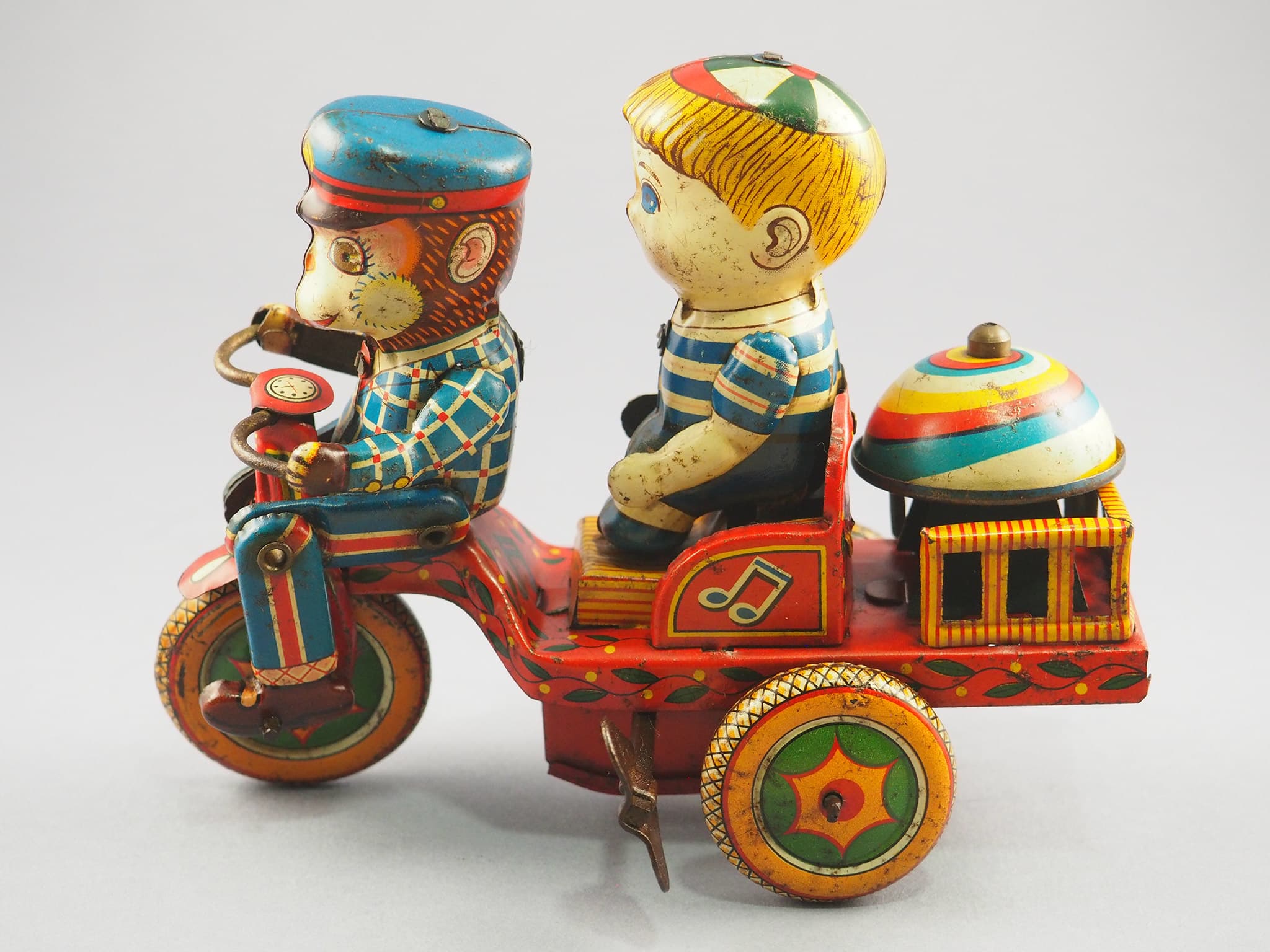 Monkey and boy on a tricycle
